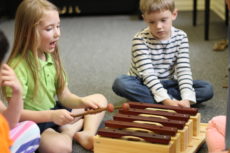 Young children in music class