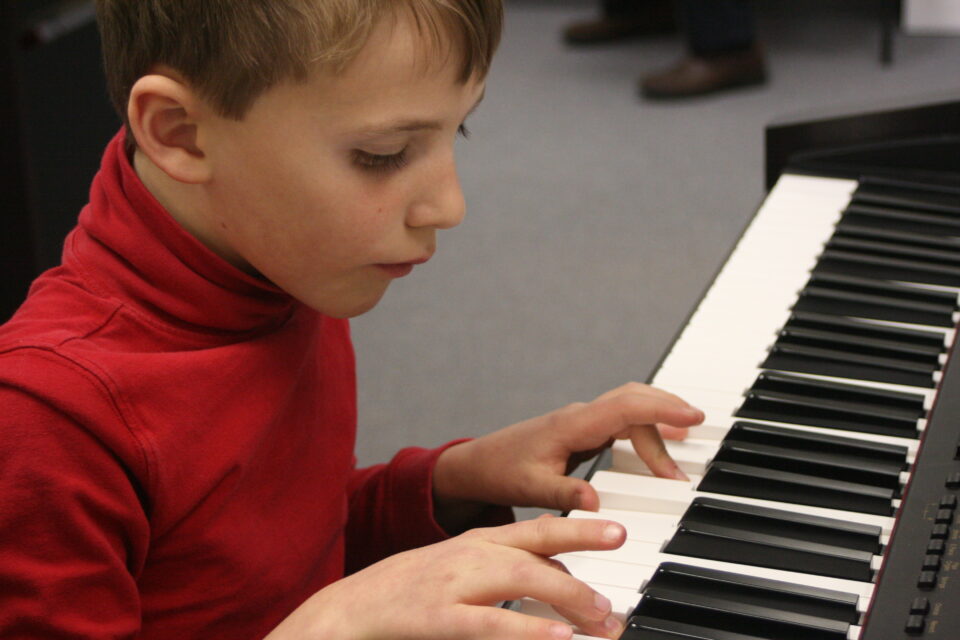 Boy playing the piano